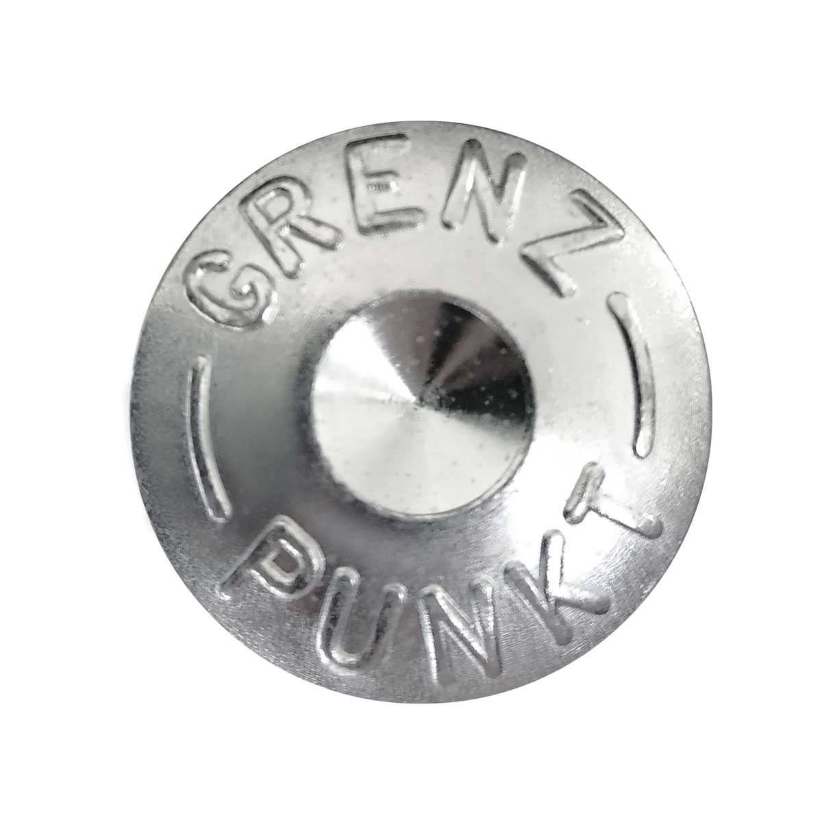 Draufsicht auf den Kopf des Superkopfbolzens mit Aufschrift Grenzpunkt und Zentrierkörnung.