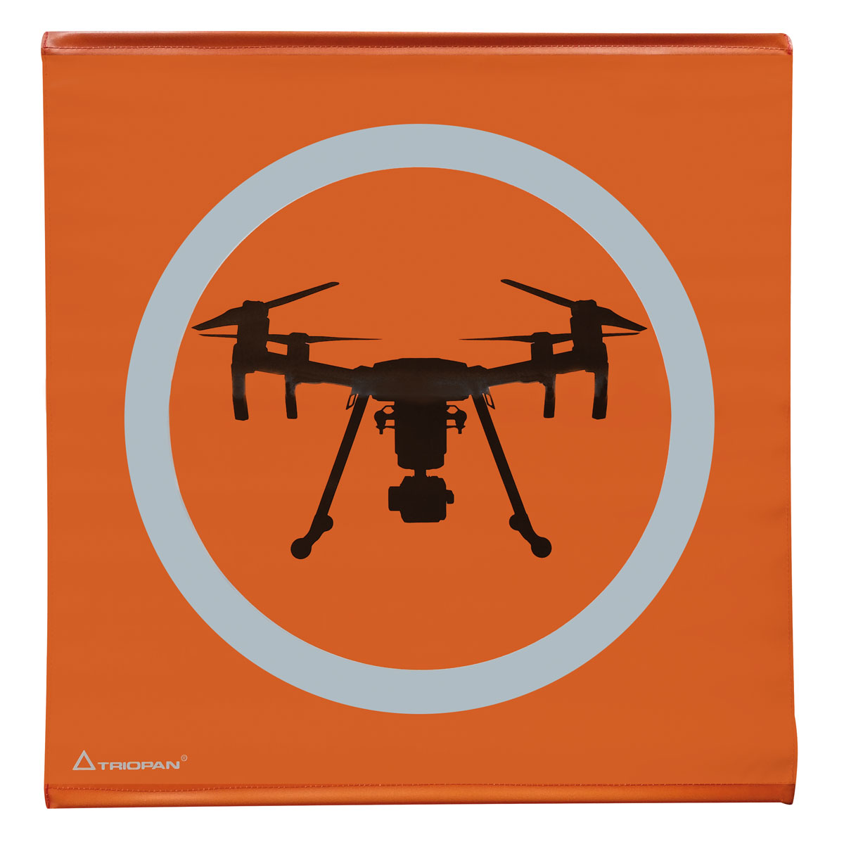 Quadratische, orangefarbene Triopan Landeplatz-Plane (50x50 cm) mit silbernem Kreis und schwarzer Drohnen-Silhouette.